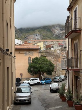 Collesano, a historic Sicilian mountain town in the Madonie Mountains, featuring narrow stone streets, traditional houses, and the Church of San Pietro, Sicily, Italy. Italian town in hills.