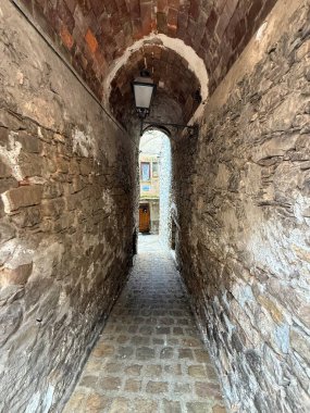 Collesano, a historic Sicilian mountain town in the Madonie Mountains, featuring narrow stone streets, traditional houses, and the Church of San Pietro, Sicily, Italy. Italian town in hills.