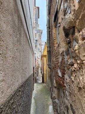 Collesano, a historic Sicilian mountain town in the Madonie Mountains, featuring narrow stone streets, traditional houses, and the Church of San Pietro, Sicily, Italy. Italian town in hills.