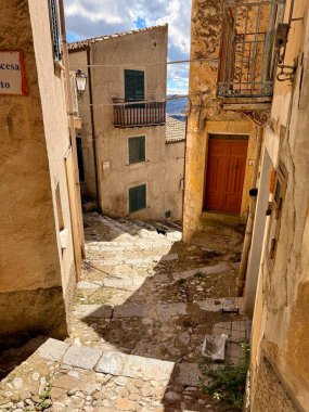 Sclafani Bagni, a small historic Sicilian mountain village perched on cliffs, featuring traditional stone houses, narrow streets, and panoramic views of the rugged Madonie Mountains, Sicily, Italy.