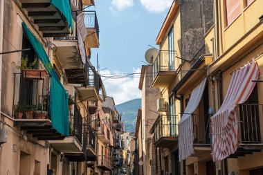 Castelbuono medieval town in the Madonie Mountains, Sicily, Italy, basking under the summer sun with historic streets, Ventimiglia Castle. Old mountain town in Sicily. Italian town in hills.
