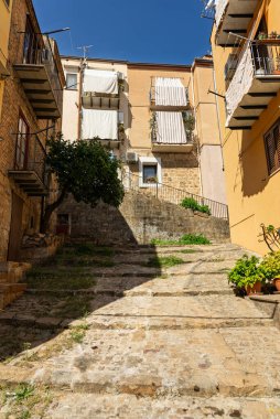 Castelbuono medieval town in the Madonie Mountains, Sicily, Italy, basking under the summer sun with historic streets, Ventimiglia Castle. Old mountain town in Sicily. Italian town in hills.