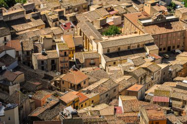 Caltavuturo, a historic Sicilian mountain town in the Madonie Mountains, featuring its medieval castle, charming narrow streets, and traditional stone houses, Sicily, Italy. Italian town in hills.