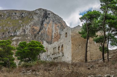 Caltavuturo, a historic Sicilian mountain town in the Madonie Mountains, featuring its medieval castle, charming narrow streets, and traditional stone houses, Sicily, Italy. Italian town in hills.