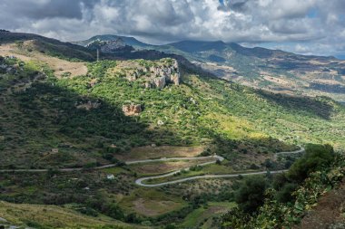 Caltavuturo, a historic Sicilian mountain town in the Madonie Mountains, featuring its medieval castle, charming narrow streets, and traditional stone houses, Sicily, Italy. Italian town in hills.