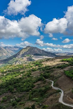 Caltavuturo, a historic Sicilian mountain town in the Madonie Mountains, featuring its medieval castle, charming narrow streets, and traditional stone houses, Sicily, Italy. Italian town in hills.