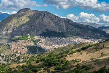 Caltavuturo, a historic Sicilian mountain town in the Madonie Mountains, featuring its medieval castle, charming narrow streets, and traditional stone houses, Sicily, Italy. Italian town in hills.