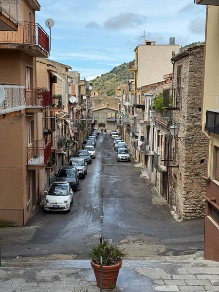 Collesano, a historic Sicilian mountain town in the Madonie Mountains, featuring narrow stone streets, traditional houses, and the Church of San Pietro, Sicily, Italy. Italian town in hills.