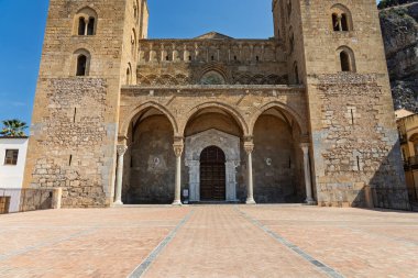 Cefalu, a historic Sicilian coastal town in northern Sicily, Italy, charming narrow streets, the Cathedral Basilica of the Transfiguration of the Lord, golden beach, and view of the Tyrrhenian Sea.