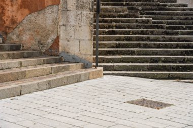 Collesano, a historic Sicilian mountain town in the Madonie Mountains, featuring narrow stone streets, traditional houses, and the Church of San Pietro, Sicily, Italy. Italian town in hills.