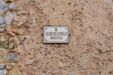 Collesano, a historic Sicilian mountain town in the Madonie Mountains, featuring narrow stone streets, traditional houses, and the Church of San Pietro, Sicily, Italy. Italian town in hills.