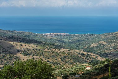 Collesano, a historic Sicilian mountain town in the Madonie Mountains, featuring narrow stone streets, traditional houses, and the Church of San Pietro, Sicily, Italy. Italian town in hills.