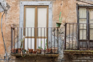Collesano, a historic Sicilian mountain town in the Madonie Mountains, featuring narrow stone streets, traditional houses, and the Church of San Pietro, Sicily, Italy. Italian town in hills.