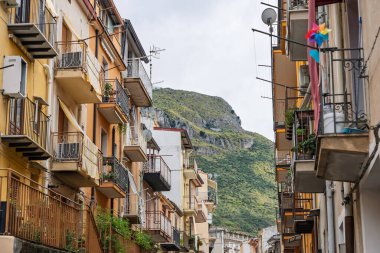 Collesano, a historic Sicilian mountain town in the Madonie Mountains, featuring narrow stone streets, traditional houses, and the Church of San Pietro, Sicily, Italy. Italian town in hills.