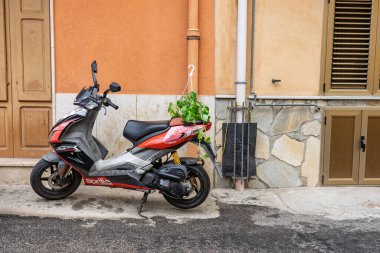 Collesano, a historic Sicilian mountain town in the Madonie Mountains, featuring narrow stone streets, traditional houses, and the Church of San Pietro, Sicily, Italy. Italian town in hills.