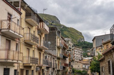 Collesano, a historic Sicilian mountain town in the Madonie Mountains, featuring narrow stone streets, traditional houses, and the Church of San Pietro, Sicily, Italy. Italian town in hills.