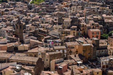 View of Isnello, a historic Sicilian mountain town in the Madonie Mountains, featuring charming narrow streets, traditional stone houses, and a Gothic church, Sicily, Italy. Italian town in hills.