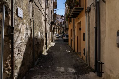 View of Isnello, a historic Sicilian mountain town in the Madonie Mountains, featuring charming narrow streets, traditional stone houses, and a Gothic church, Sicily, Italy. Italian town in hills.