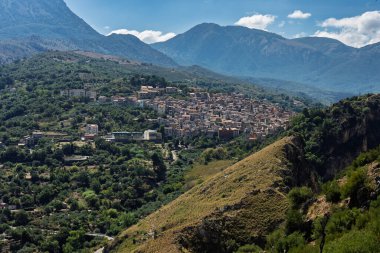 View of Isnello, a historic Sicilian mountain town in the Madonie Mountains, featuring charming narrow streets, traditional stone houses, and a Gothic church, Sicily, Italy. Italian town in hills.
