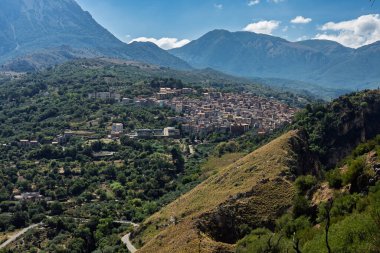 View of Isnello, a historic Sicilian mountain town in the Madonie Mountains, featuring charming narrow streets, traditional stone houses, and a Gothic church, Sicily, Italy. Italian town in hills.