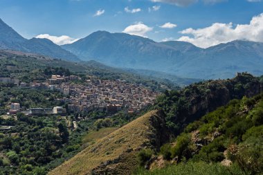View of Isnello, a historic Sicilian mountain town in the Madonie Mountains, featuring charming narrow streets, traditional stone houses, and a Gothic church, Sicily, Italy. Italian town in hills.