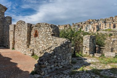 Polizzi Generosa, a picturesque Sicilian mountain town perched on rocky cliffs showcasing traditional stone buildings and panoramic views of the Madonie Mountains, Sicily, Italy.