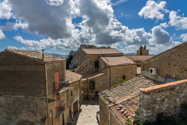 Sclafani Bagni, a small historic Sicilian mountain village perched on cliffs, featuring traditional stone houses, narrow streets, and panoramic views of the rugged Madonie Mountains, Sicily, Italy.