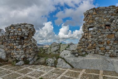 Sclafani Bagni, a small historic Sicilian mountain village perched on cliffs, featuring traditional stone houses, narrow streets, and panoramic views of the rugged Madonie Mountains, Sicily, Italy.