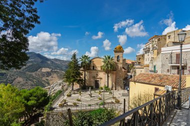 Sclafani Bagni, a small historic Sicilian mountain village perched on cliffs, featuring traditional stone houses, narrow streets, and panoramic views of the rugged Madonie Mountains, Sicily, Italy.