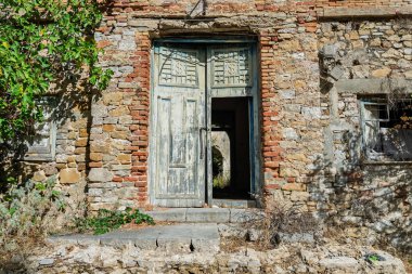 Abandoned sanatorium with a historic church in Sclafani Bagni, a small Sicilian mountain village in the Madonie Mountains, featuring decayed stone buildings and scenic landscapes, Sicily, Italy.