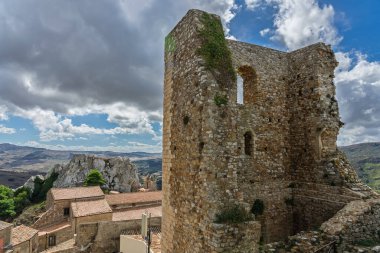 Sclafani Bagni, a small historic Sicilian mountain village perched on cliffs, featuring traditional stone houses, narrow streets, and panoramic views of the rugged Madonie Mountains, Sicily, Italy.
