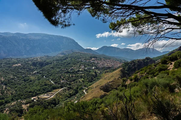 View of Isnello, a historic Sicilian mountain town in the Madonie Mountains, featuring charming narrow streets, traditional stone houses, and a Gothic church, Sicily, Italy. Italian town in hills.