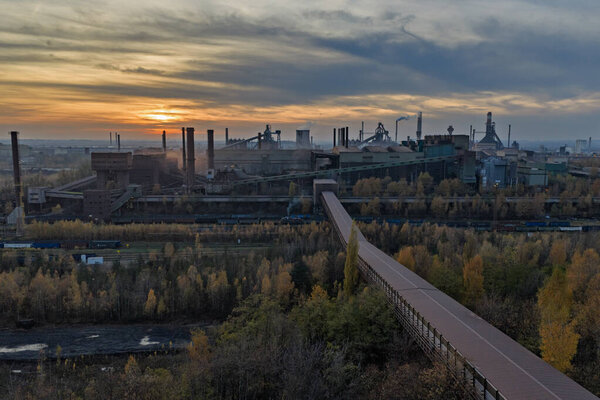 Aerial drone view of Industrial steel factory, iron works. Metallurgical plant. steelworks. Heavy industry in Europe, Poland, Dabrowa Gornicza. Air pollution from chimneys. Ecology and environmental.