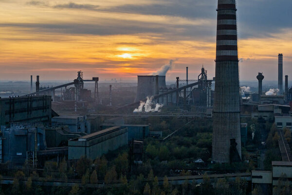 Aerial drone view of Industrial steel factory, iron works. Metallurgical plant. steelworks. Heavy industry in Europe, Poland, Dabrowa Gornicza. Air pollution from chimneys. Ecology and environmental.