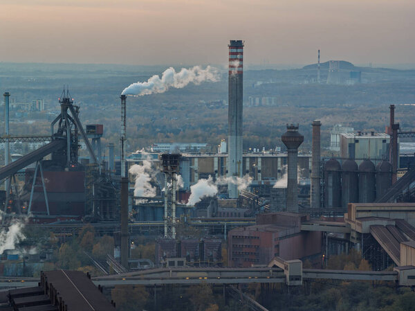Aerial drone view of Industrial steel factory, iron works. Metallurgical plant. steelworks. Heavy industry in Europe, Poland, Dabrowa Gornicza. Air pollution from chimneys. Ecology and environmental.