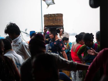 Mumbai, India - January 1, 2021 :  Unidentified Women and men trade in a wide variety of fish at one of the oldest fish market in Mumbai called Bhaucha Dhakka.