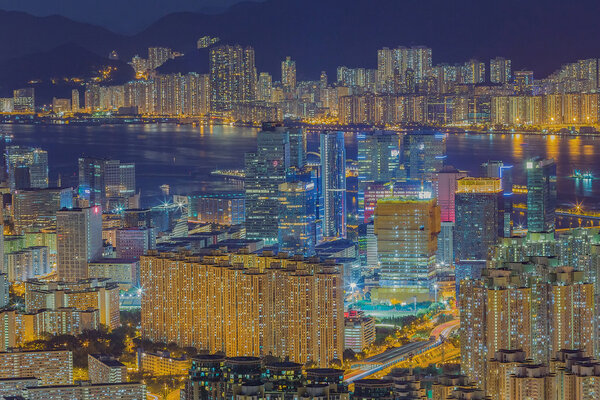 Skyline and cityscape of modern city hongkong at night from aerial view
