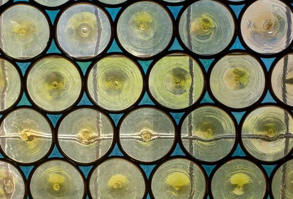 Stained glass yellow circles pattern with black outline. Abstract. Texture.