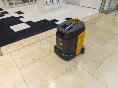 Bratislava, Slovakia - November, 16, 2025 : SlovClean Robotic Cleaner Cleaning Floor in Eurovea Bratislava