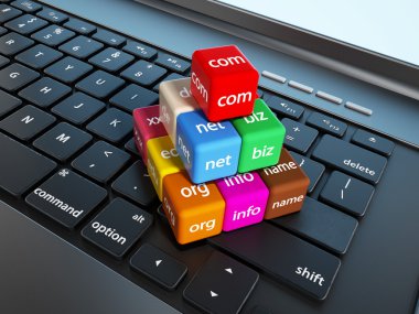 Domain name cubes standing on laptop computer keyboard clipart
