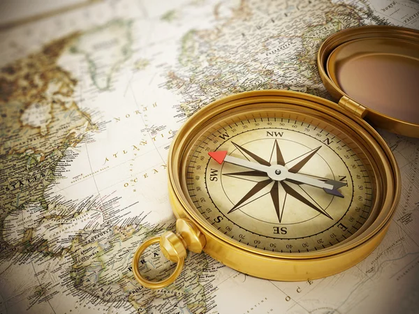 Vintage compass standing on old map — Stock Photo, Image