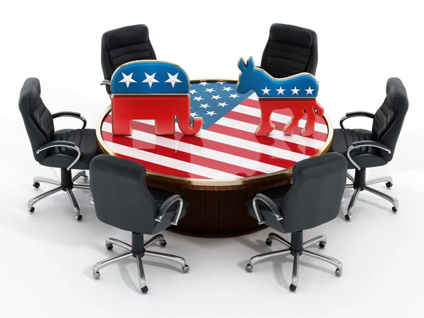 Символы политической партии США, стоящие на покрытом американским флагом столе — стоковое фото