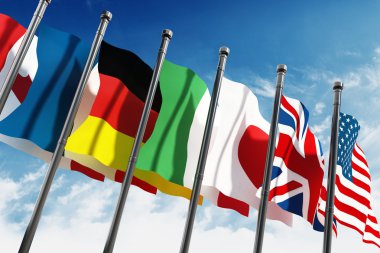 G7 ülke bayrakları sallayarak üzerinde mavi gökyüzü 