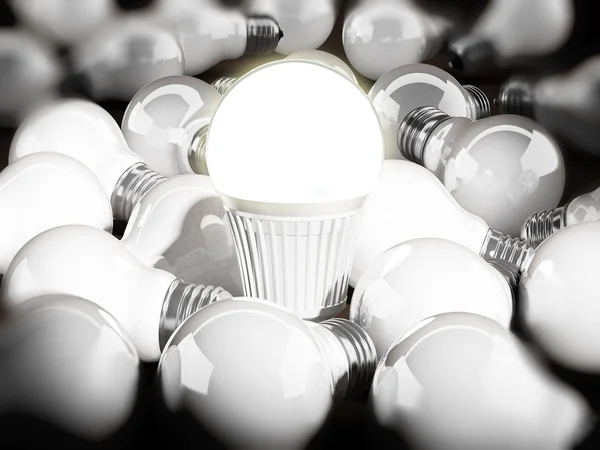 Lampadina ad alta efficienza energetica tra le lampadine standard. Illustrazione 3d — Foto Stock