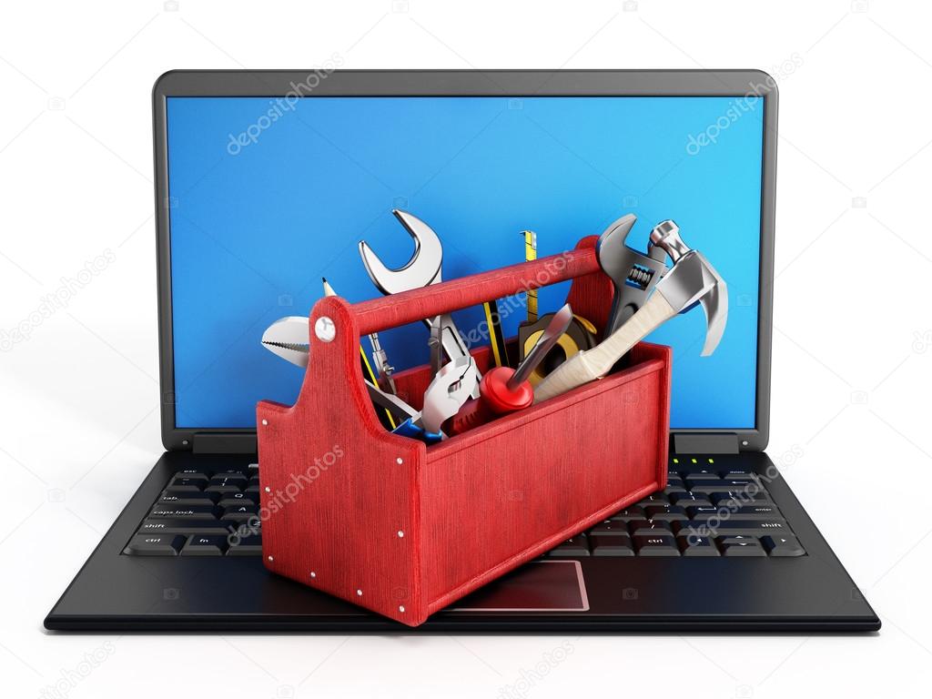 Red toolbox standing on laptop computer