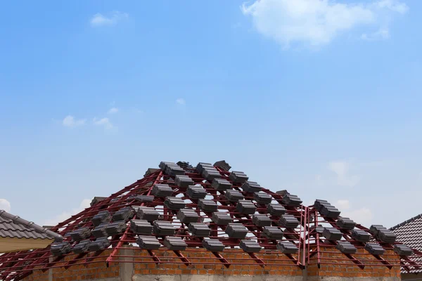 Black tile roof on residential building construction house — Stock Photo, Image