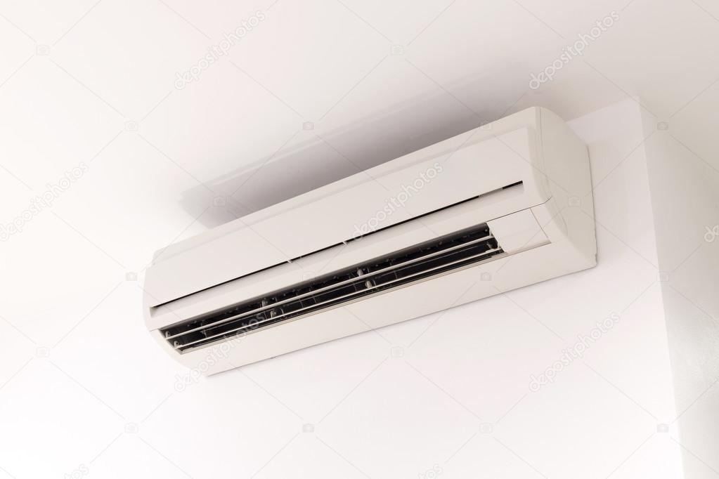 air conditioner on white mortar wall background