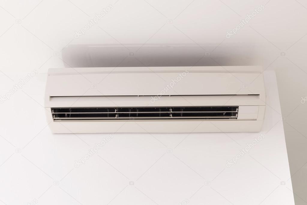 air conditioner on white mortar wall background