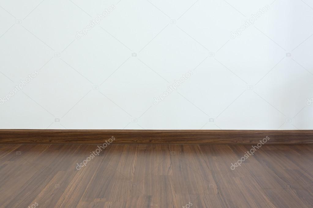 empty room, white mortar wall background and wood laminate floor