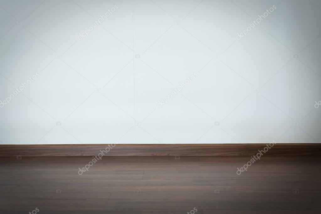 empty room, white mortar wall background and wood laminate floor